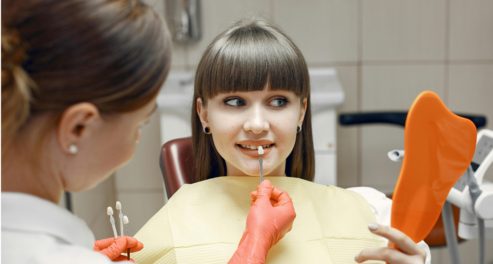 Dentist in Caledon performing professional teeth whitening treatment at Caledon Dental Centre